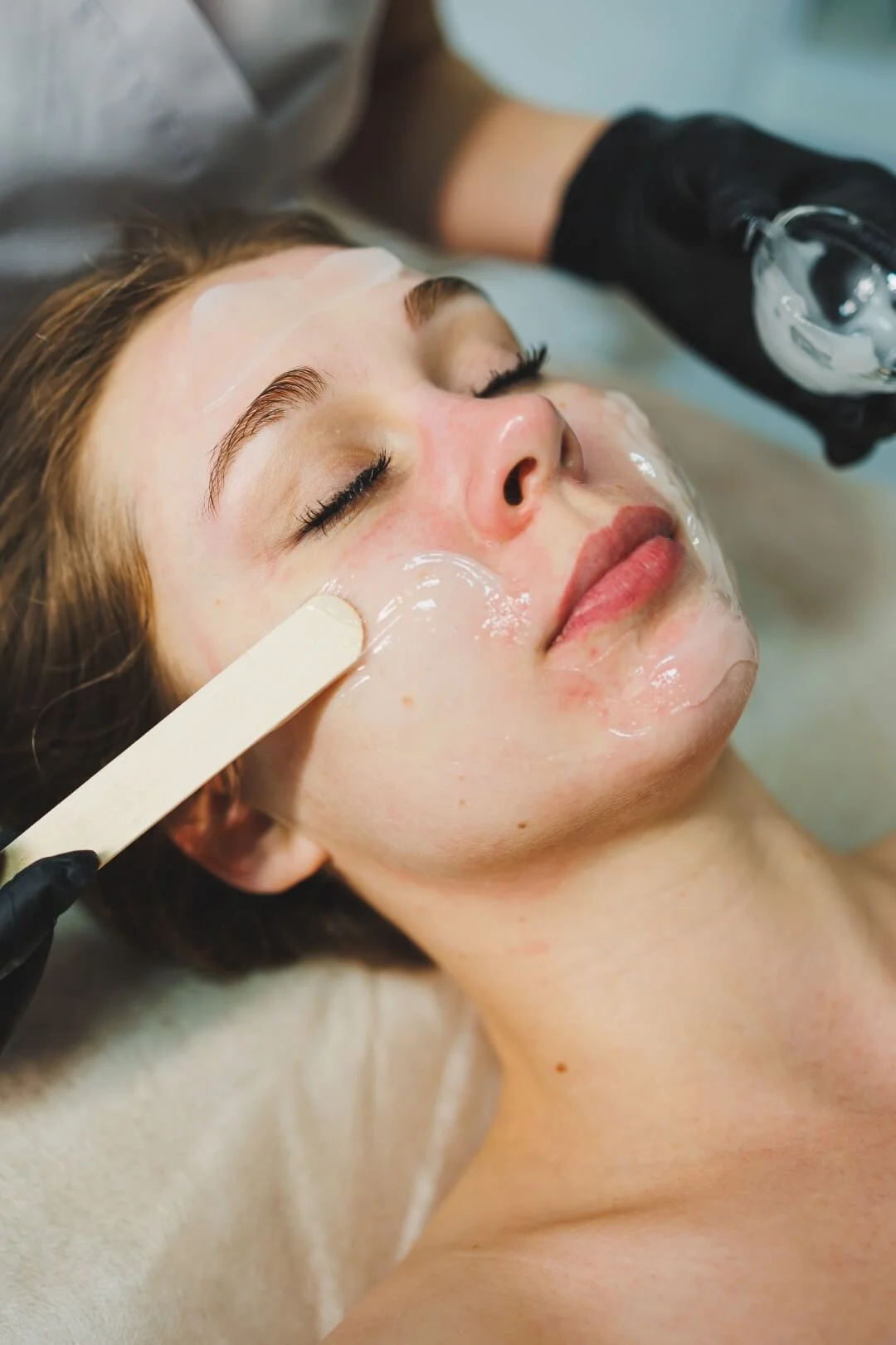 hands-beautician-apply-mask-womans-face-spa-salon-aesthetic-procedure-facial-skin-care (Large)